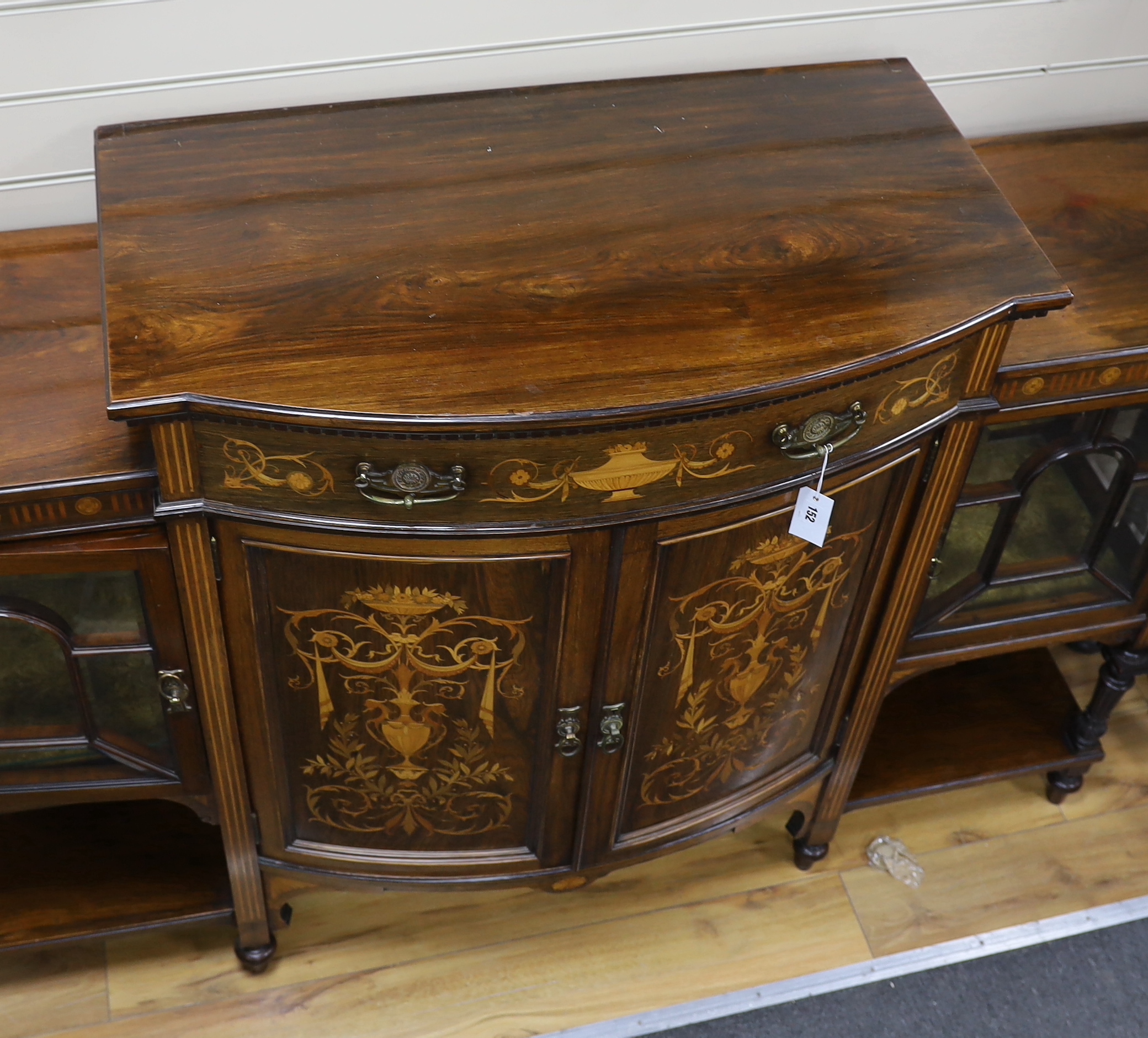 A late Victorian marquetry inlaid rosewood bow front side cabinet, width 168cm, depth 48cm, height 111cm